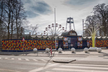 Aarhus, Denmark - March 24, 2020: Tivoli Fiheden in Aarhus is snark ready to open for the season, colorful entrance to the amusement park, rides are seen in the backgroundのeditorial素材