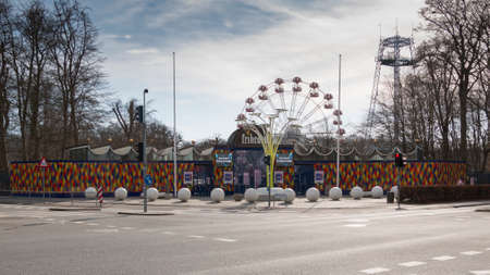 Aarhus, Denmark - March 24, 2020: Tivoli Fiheden in Aarhus is snark ready to open for the season, colorful entrance to the amusement park, rides are seen in the backgroundのeditorial素材