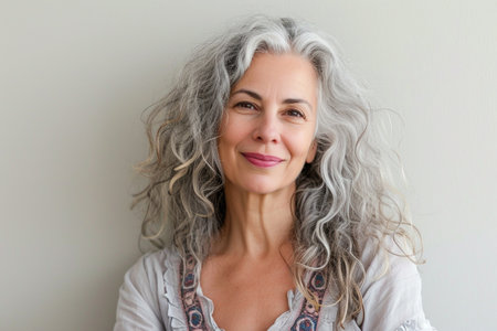 Portrait of a beautiful middle-aged woman with gray hair.の素材