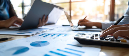 Business team meeting present. Photo professional investor working with new startup project. Finance managers meeting.Digital tablet laptop computer design smart phone using.の素材