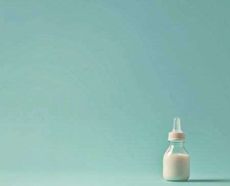 Bottle of milk on a blue background. Place for text.の素材