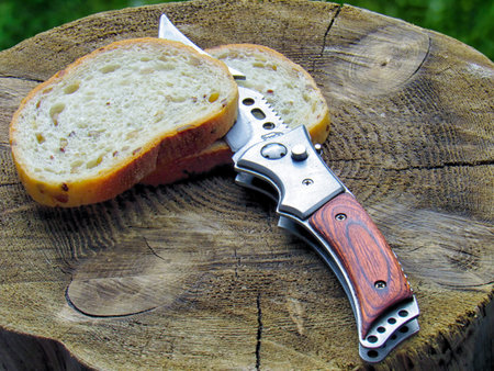 White bread by knife outdoors