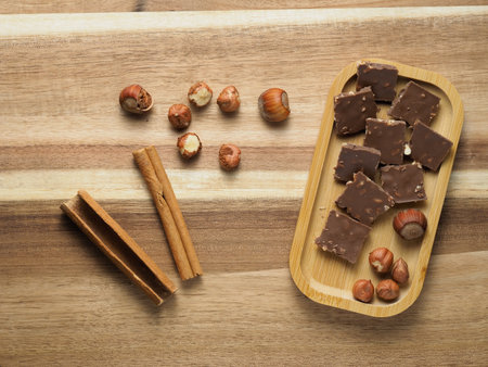 walnuts and hazelnuts, vanilla, chocolate with nuts, background, wooden countertop, top view, healthy unsaturated fats, plant protein, fiber, vitamins and mineralsの写真素材
