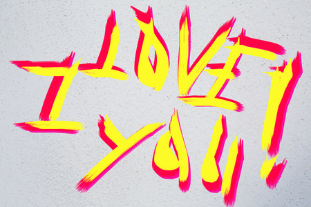 I love you. Graffiti like text in yellow and red. Light grey background. Illustration with romantic youth spirit. Declaration of love. Poster and wallpaper picture. Saint Valentines concept.の写真素材