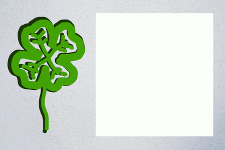 Drawn picture of green quatrefoil with shadow and square white copy space on right. Light grey...