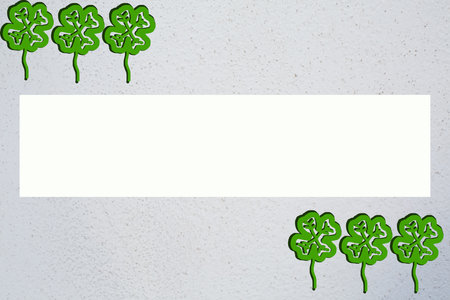 Picture of three green quatrefoils in upper left and down right corner with copy spaceの写真素材