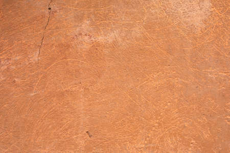 Orange wall outdoors. Background picture.Sample of Panted aged Concrete surface with terracotta plaster. Wallpaper textured picture. top view.の写真素材
