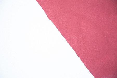 Macro shot of vibrant pink paper on a white background