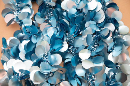 A detailed close up view of blue and white sequins elegantly arranged on a tableの写真素材