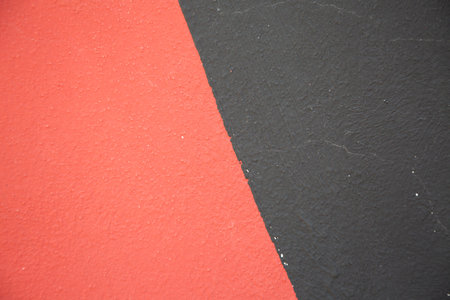 A detailed close up view of a beautifully designed red and black carpetの写真素材