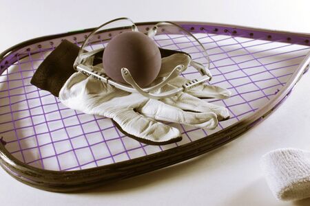 Racquetball racquet, ball, eyewear, glove and headband isolated on a bright backgroundの写真素材