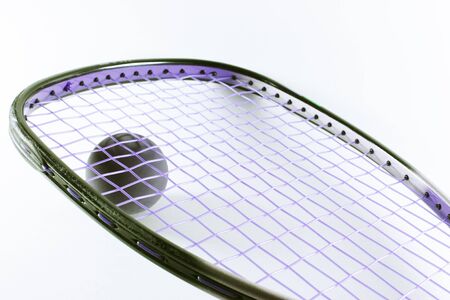 Racquetball racquet and ball isolated on bright backgroundの写真素材