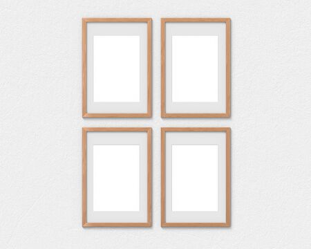 Set of 4 vertical wooden frames mockup with a border hanging on the wall. Empty base for picture or text. 3D rendering.の写真素材