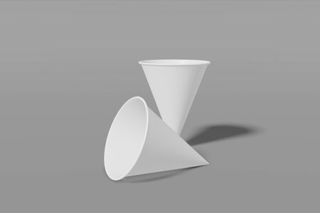Set of two white paper mockup cups cone shaped on a grey background. 3D renderingの写真素材