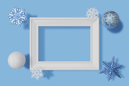 3d rendering horizontal picture frame mockup, snowflakes and balls with frosty texture on a blue backgroundの写真素材