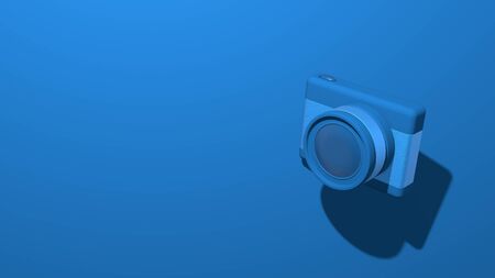 Modern small photo camera with a lens. Stylish minimal abstract horizontal scene, place for text. Trendy classic blue color. 3D renderingの写真素材