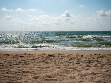 sandy sea coast. Sea waves to the horizonの写真素材