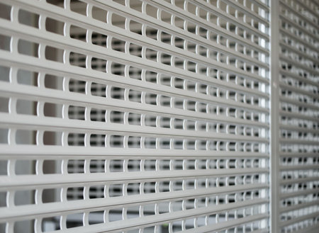 Barred with a white profile grate part of the room. selective focus