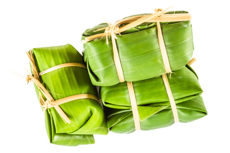 Khao tom mad is a Thai traditional dessert made from sticky rice, coconut milk, sugar , and bananas wrap with banana leaf の写真素材