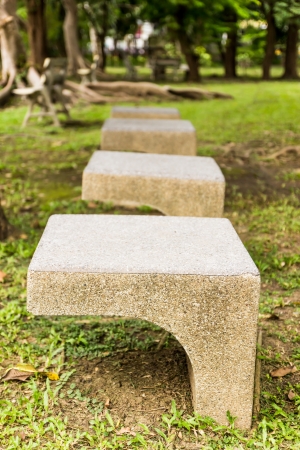 Stone chair  in gardenの写真素材