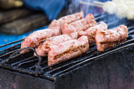 Grilled Minced Pork with Sticky Rice  Grilled Sour Preserved Pork  ;Thai call naem, fermented ground porkの写真素材