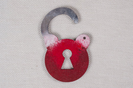 Symbolic wooden lock on a white background. Copy space