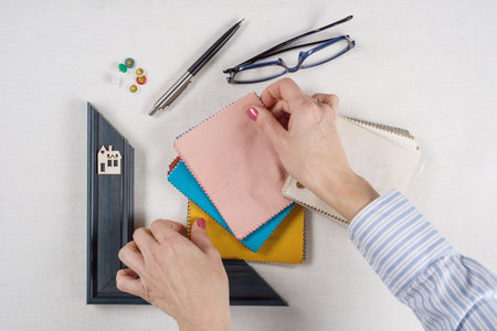 Home renovation. Workplace of the architect, designer with drawings, samples of decorative materials