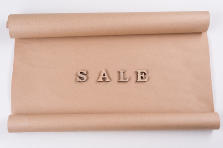 Word SALE abstract wooden letters, background vintage kraft paperの写真素材