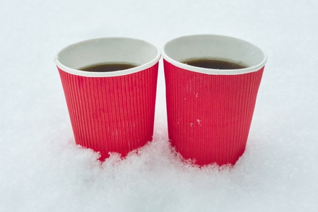 Two cups of coffee. Winter background, white snowの写真素材