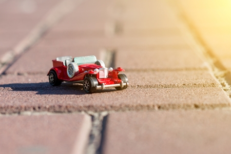 Toy retro car - a symbol of travel and adventureの写真素材