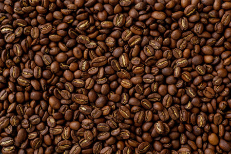 Texture, background. Roasted coffee beans close up