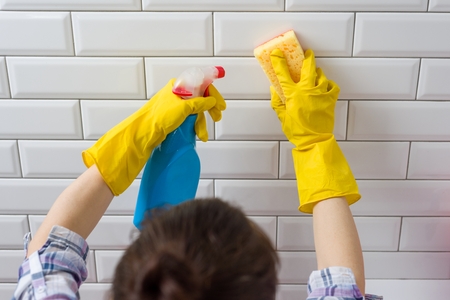 House cleaning. Woman doing chores in bathroom at home.の写真素材