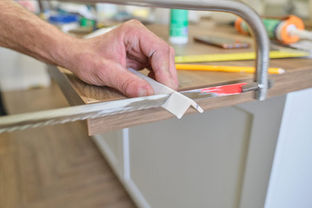 Repair in the house, installation and cutting of wooden painted corners.