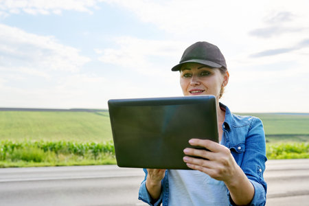 Smart farming and digital agriculture, female agricultural worker with digital tablet in the...