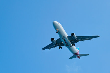 Greece Santorini, 11-09-2019. Eurowings, plane in the sky over greek famous tourist volcanic island Santorini. Air transport, tourism, travel conceptのeditorial素材
