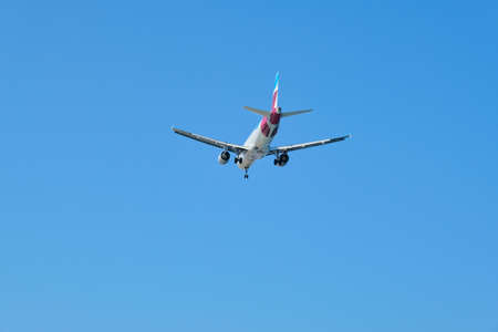 Greece Santorini, 11-09-2019. Eurowings, plane in the sky over greek famous tourist volcanic island Santorini. Air transport, tourism, travel conceptのeditorial素材