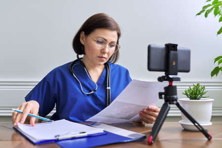 Online doctor consultation, female talking with patient using video callの写真素材