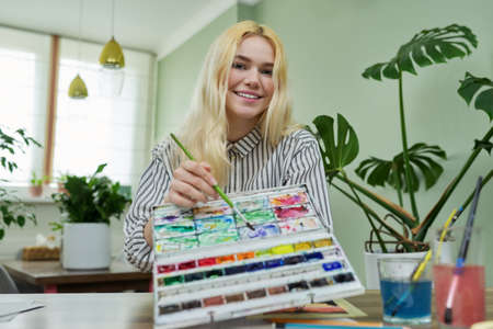 Teenage girl recording video drawing lesson using video communicationの写真素材