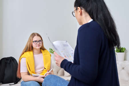Female teacher teaching individually, lesson for preteen girlの写真素材