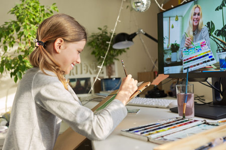 Creative online drawing lesson. Girl child drawing with watercolors