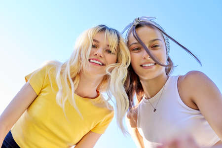 Close-up of happy smiling faces of teenage girlsの写真素材