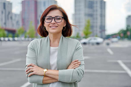 Outdoor portrait of confident middle age business womanの写真素材