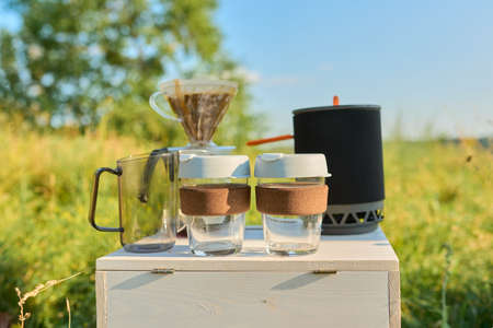 Camping coffee outdoor, preparation of natural coffee using grinder and makerの写真素材