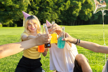 Teenage birthday party picnic on the grass in the park