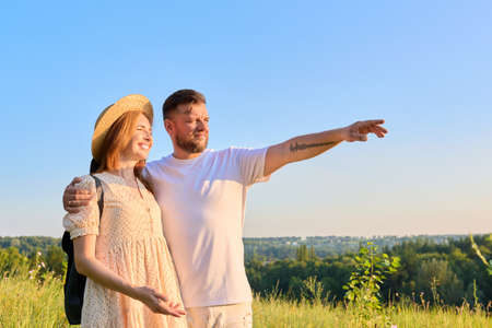 Happy middle age couple looking into the distance at the horizonの写真素材