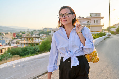 Eco tourism, woman walking relaxing in European mountain village