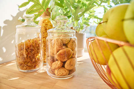 Dry fruits in a jar, figs, raisins, apples. Food storage in the kitchenの写真素材