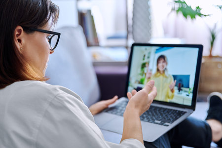 Online consultation, female teache talking to teenage student