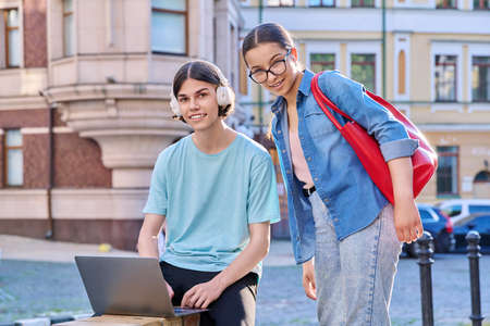 Teenage male and female using laptop for study, leisure, outdoor ,の写真素材