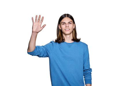 Young guy looking at camera waving his hand, on white isolated background